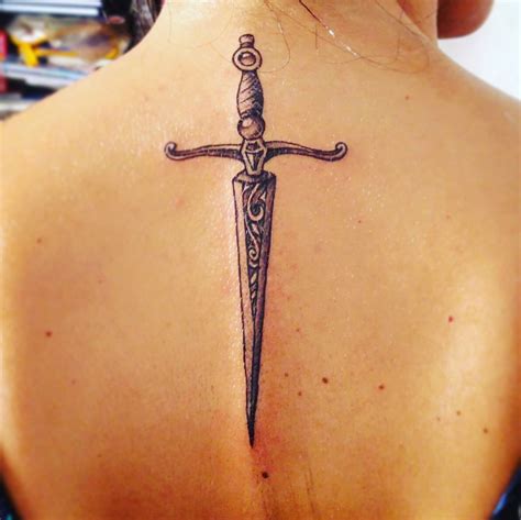 female sword tattoo